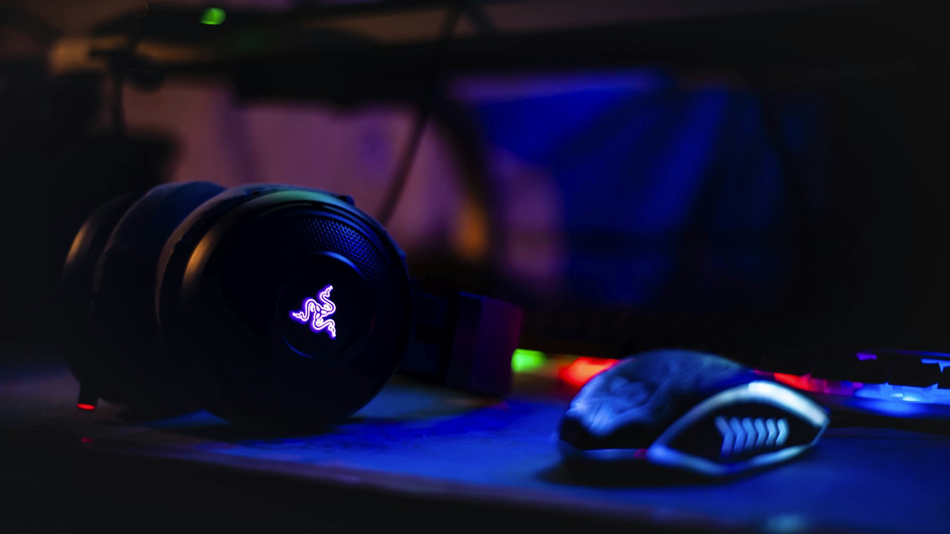 Illuminated gaming setup with mechanical keyboard and monitor